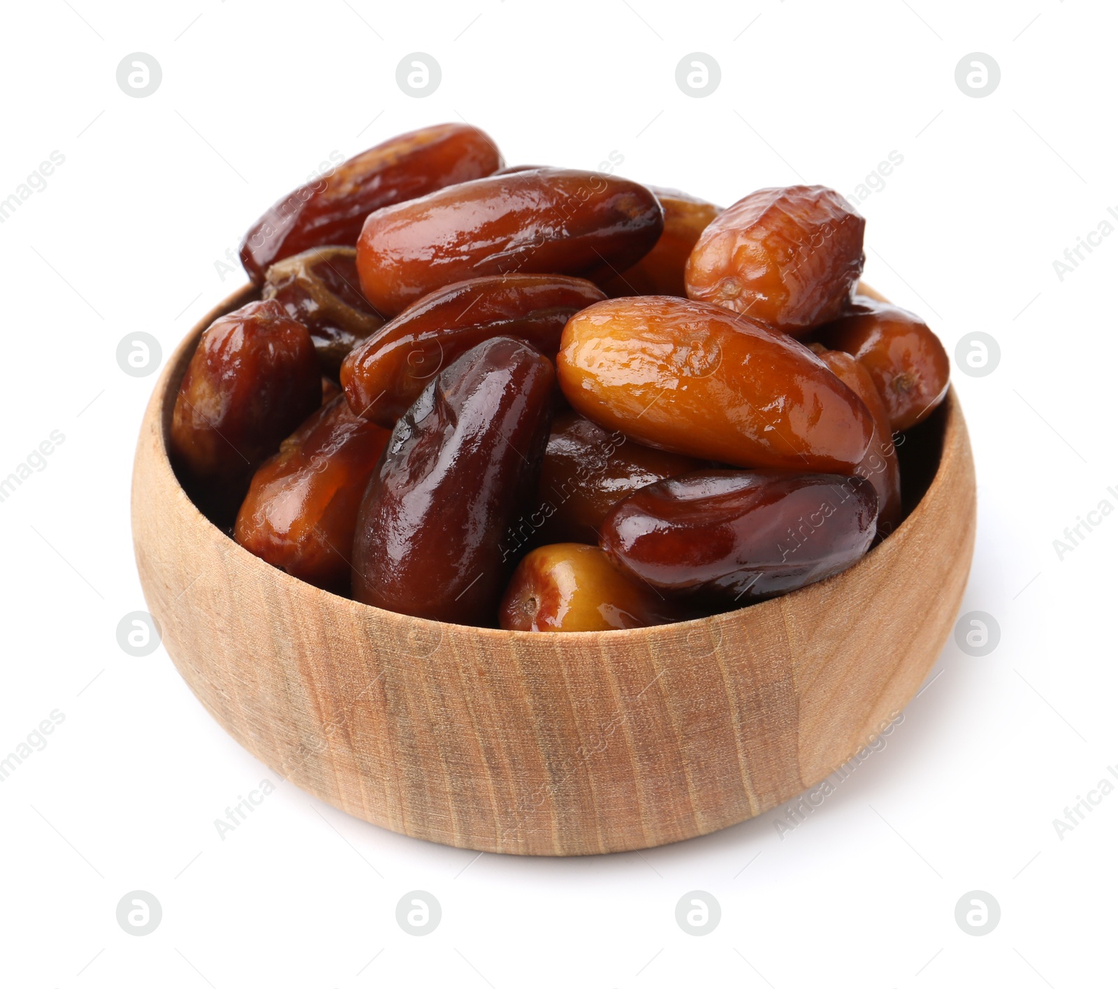 Photo of Tasty sweet dried dates in wooden bowl isolated on white