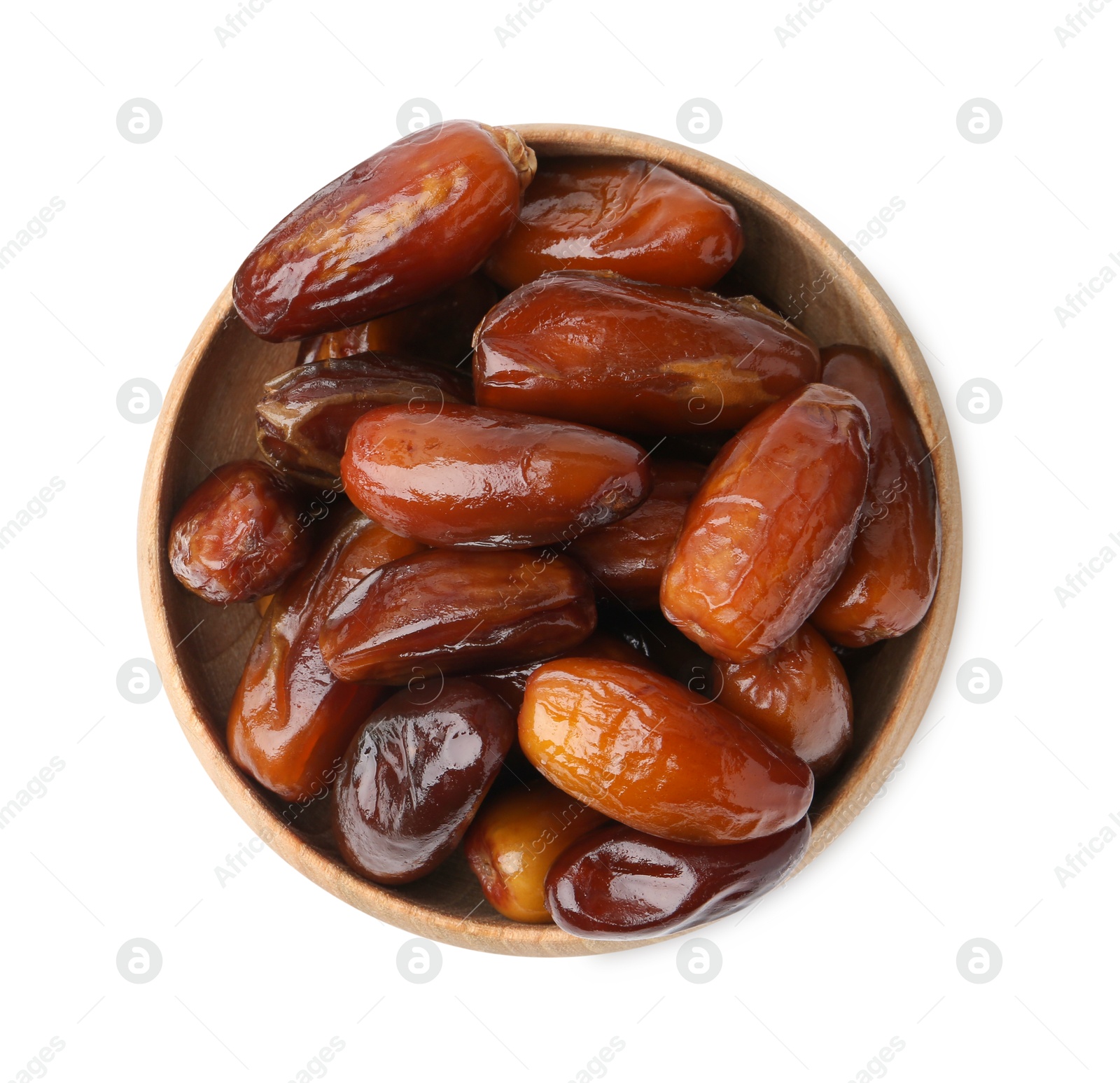 Photo of Tasty sweet dried dates in wooden bowl isolated on white, top view