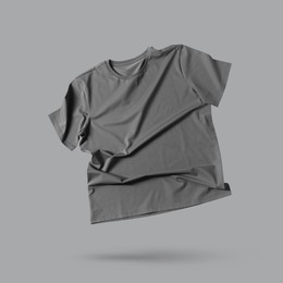 Image of Grey t-shirt in air on color background