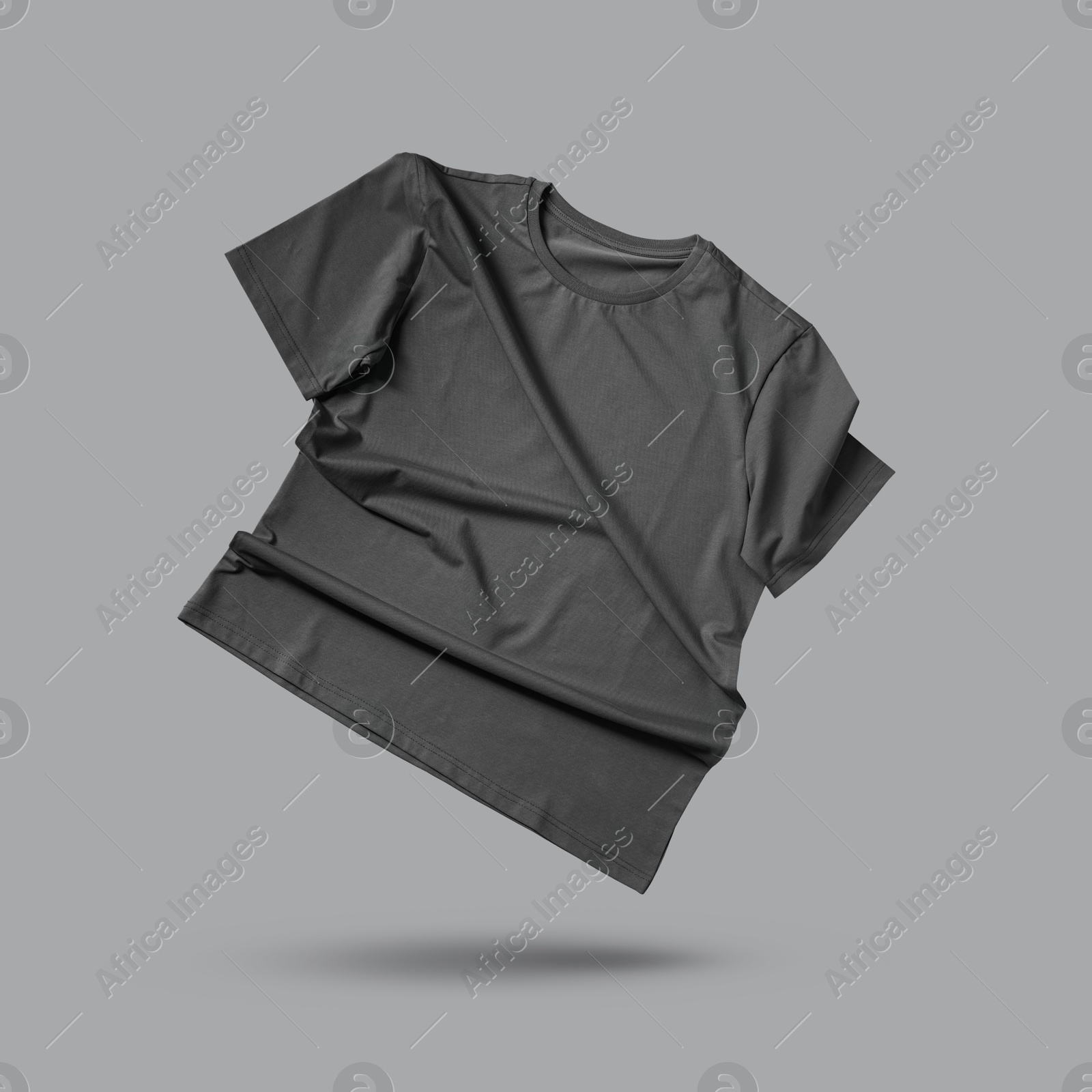 Image of Grey t-shirt in air on color background