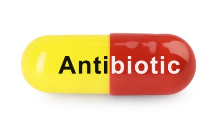 Image of Capsule with word Antibiotic on white background