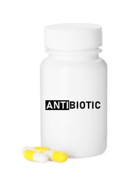 Image of Bottle of antibiotic pills on white background