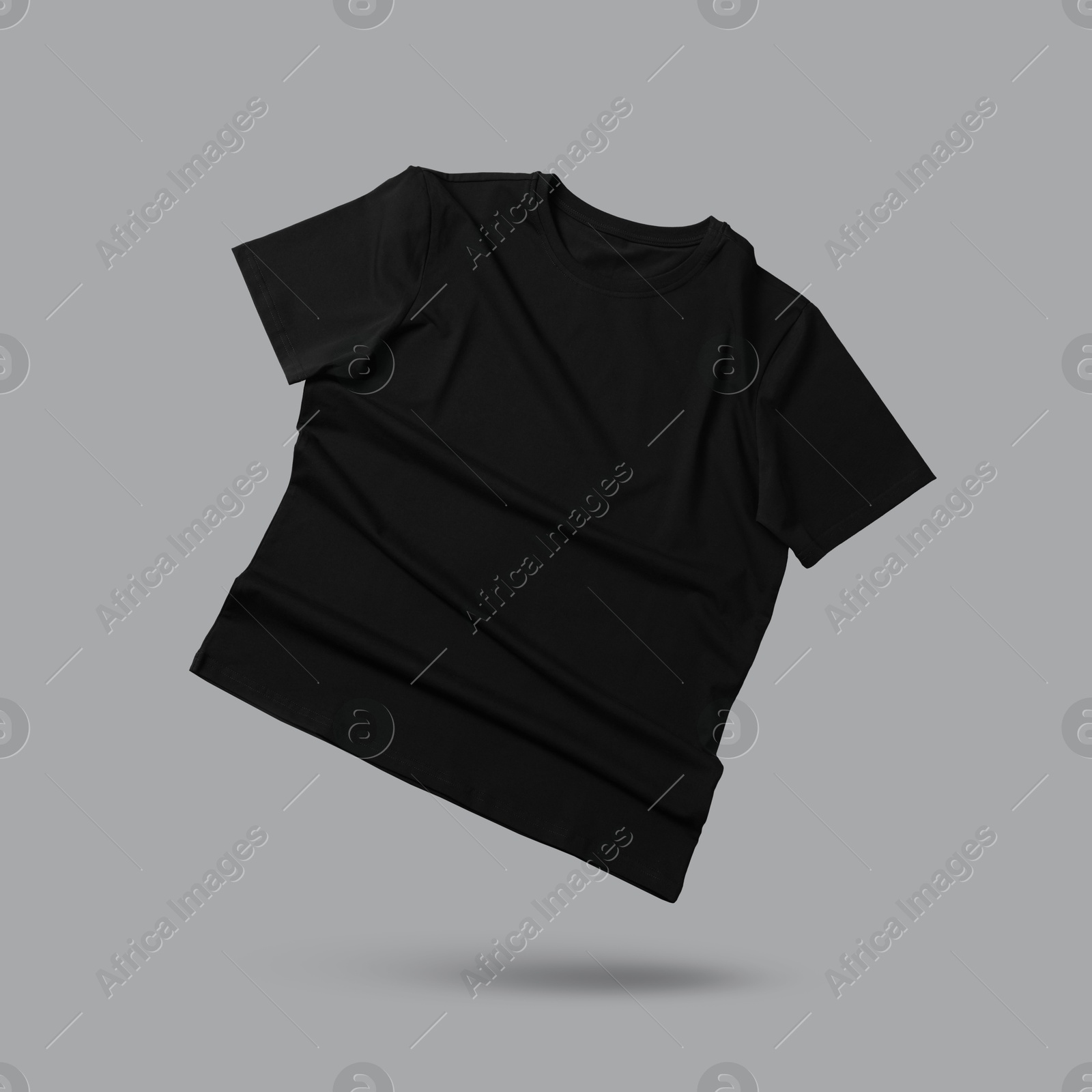 Image of Black t-shirt in air on grey background