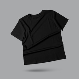 Image of Black t-shirt in air on grey background