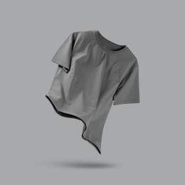 Image of Grey t-shirt in air on color background