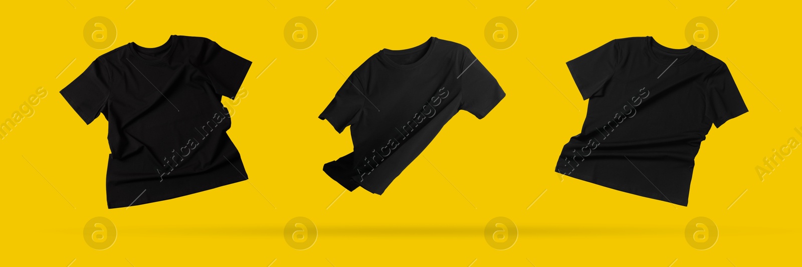 Image of Black t-shirts in air on golden background