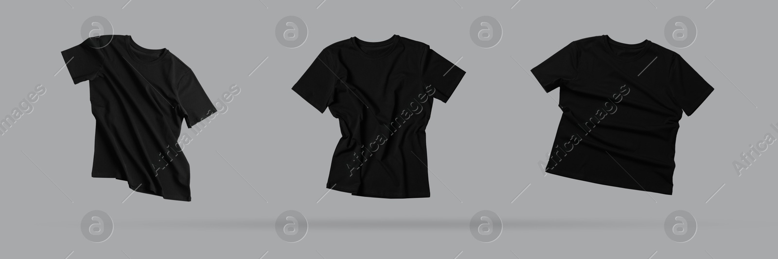 Image of Black t-shirts in air on grey background