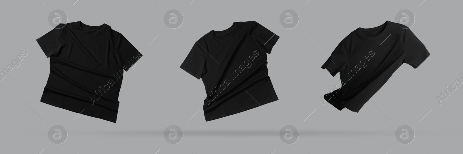 Image of Black t-shirts in air on grey background