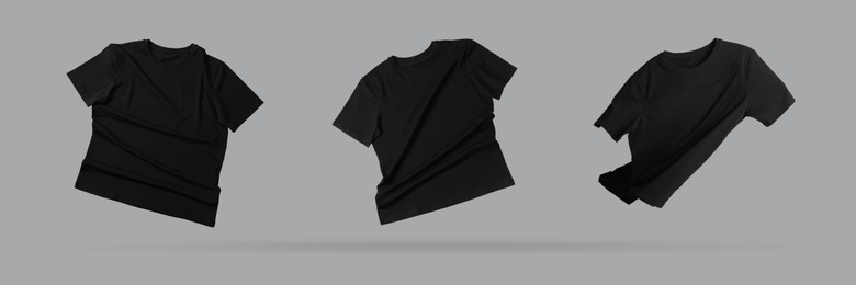 Image of Black t-shirts in air on grey background