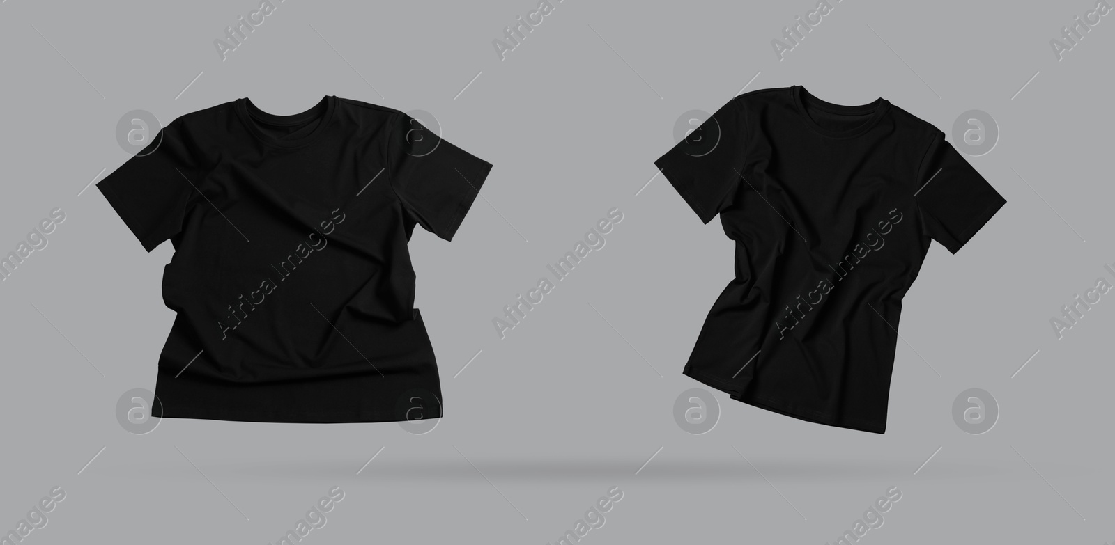 Image of Black t-shirts in air on grey background