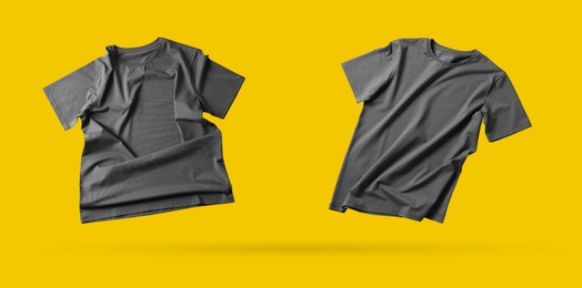 Image of Grey t-shirts in air on golden background