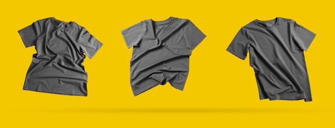 Image of Grey t-shirts in air on golden background