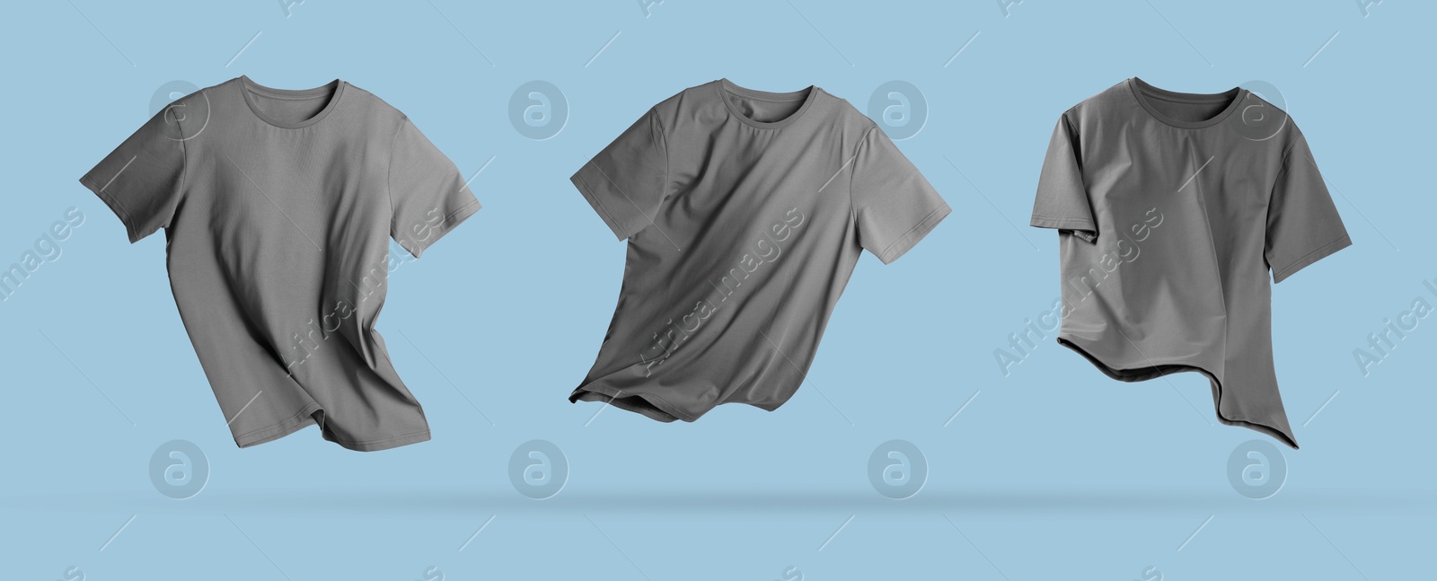 Image of Grey t-shirt in air on light blue background