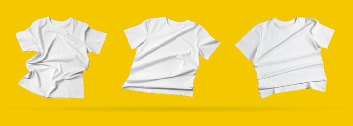 Image of White t-shirts in air on golden background