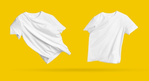 Image of White t-shirts in air on golden background