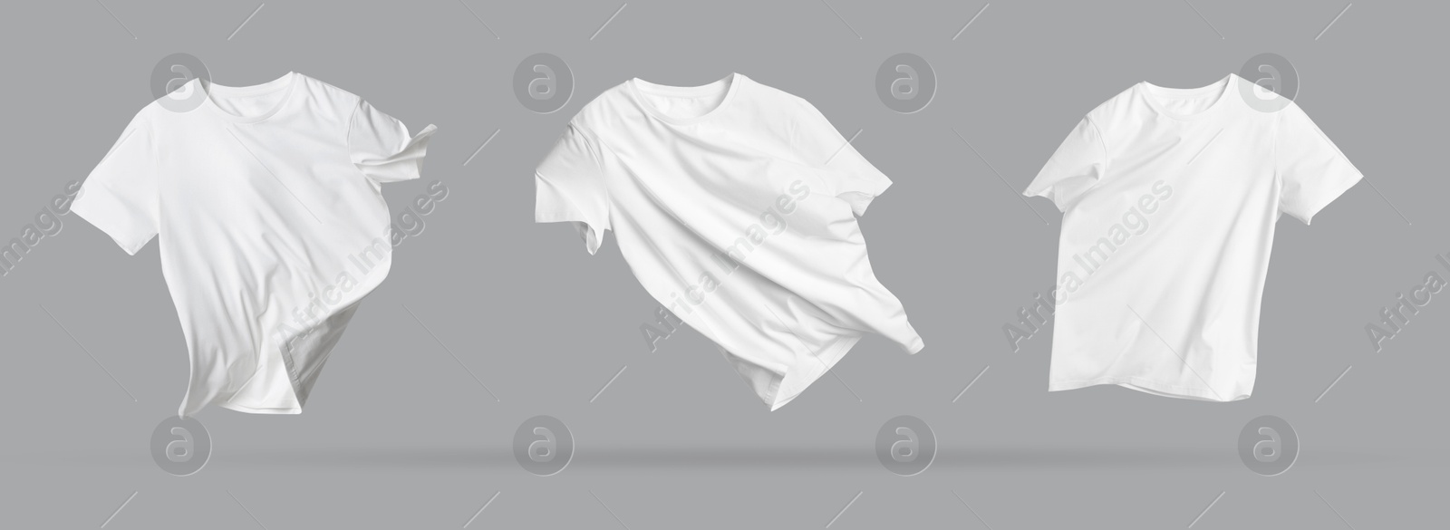 Image of White t-shirts in air on grey background