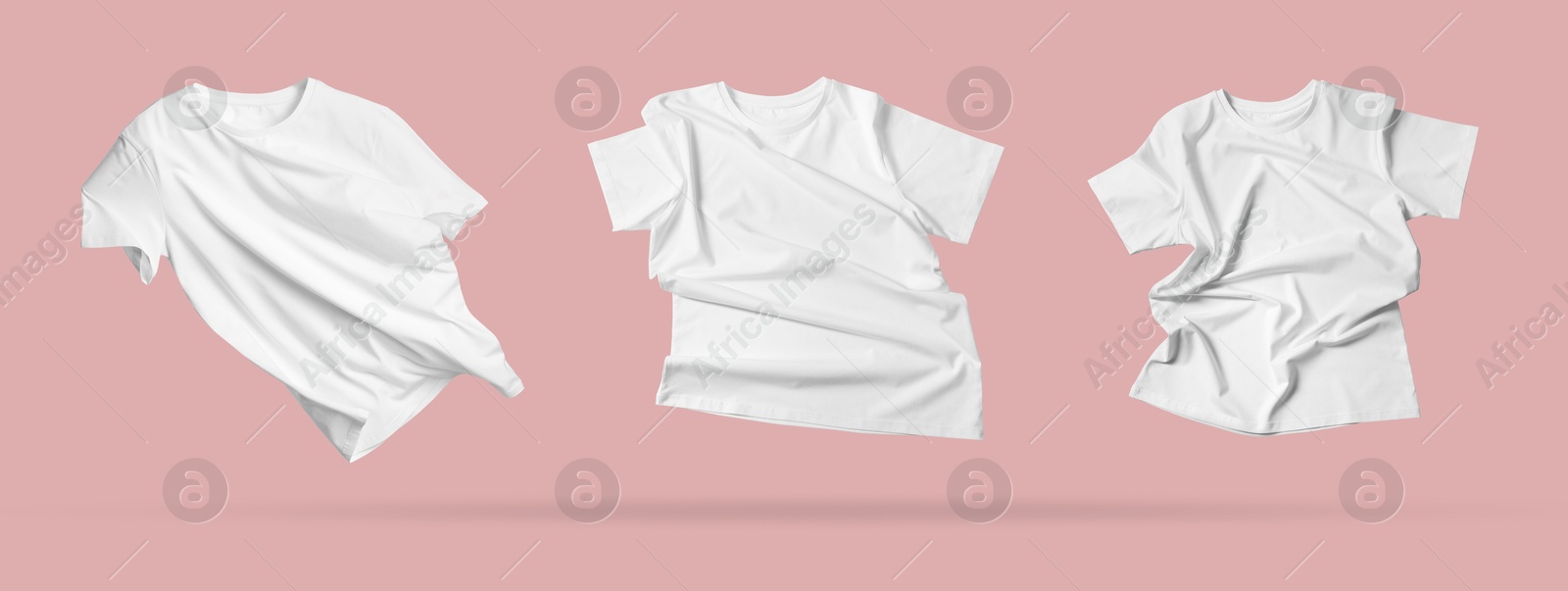 Image of White t-shirts in air on pink background