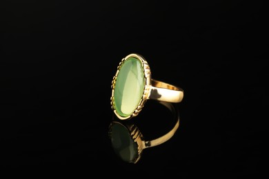 Beautiful bijouterie. Stylish ring on black background