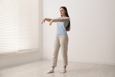 Photo of Young woman suffering from sleepwalking at home