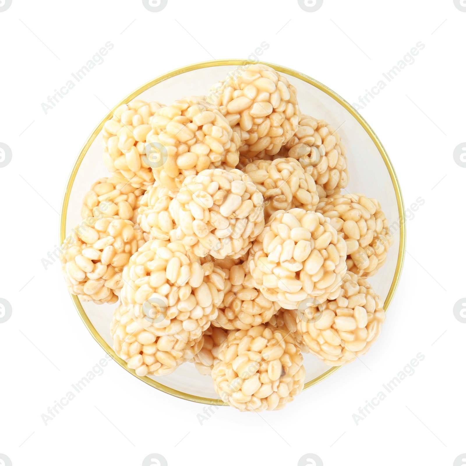 Photo of Delicious puffed rice balls in bowl isolated on white, top view