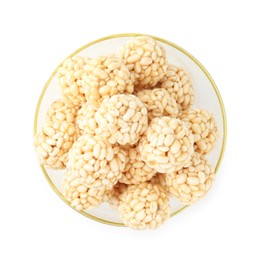 Photo of Delicious puffed rice balls in bowl isolated on white, top view