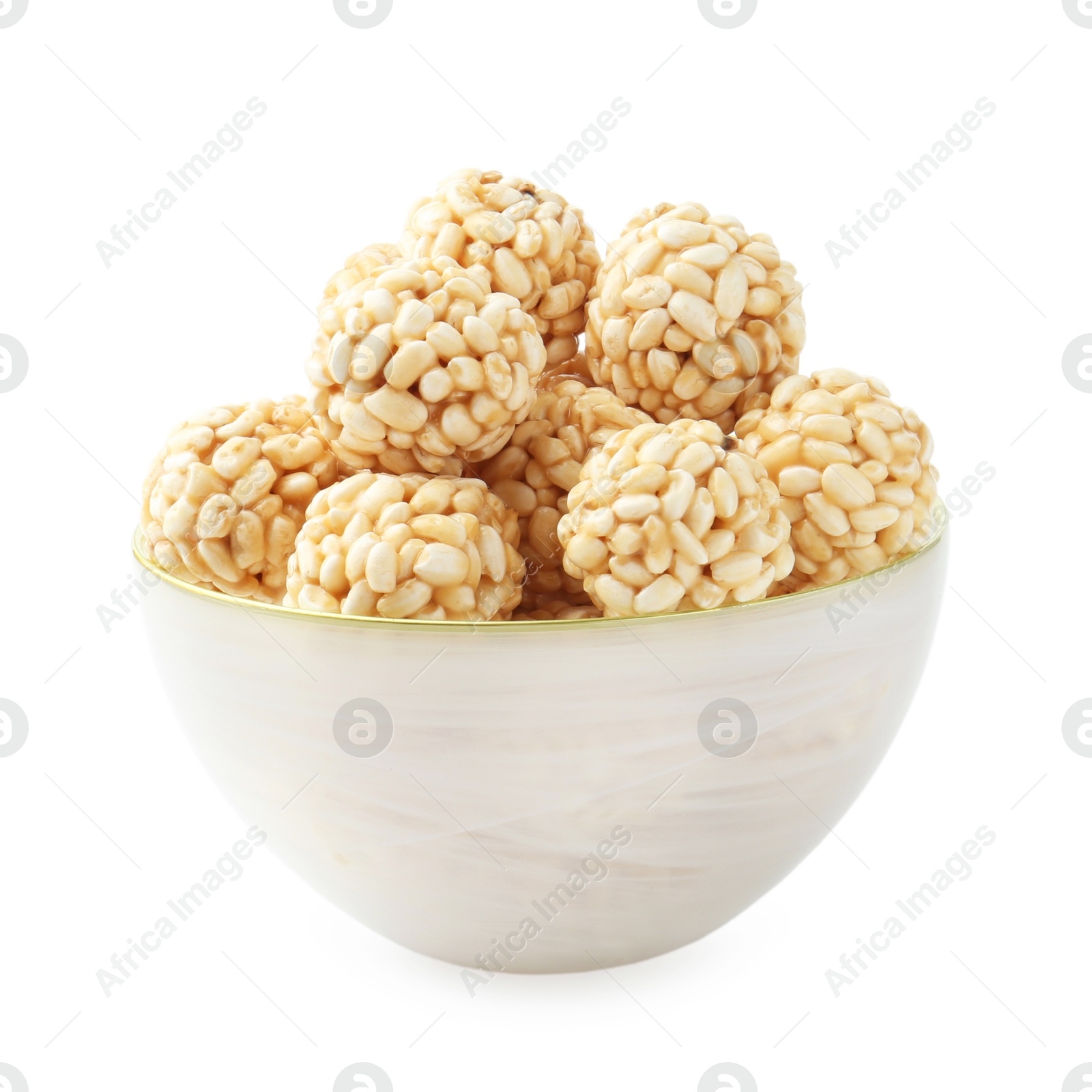 Photo of Delicious puffed rice balls in bowl isolated on white