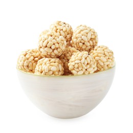 Photo of Delicious puffed rice balls in bowl isolated on white