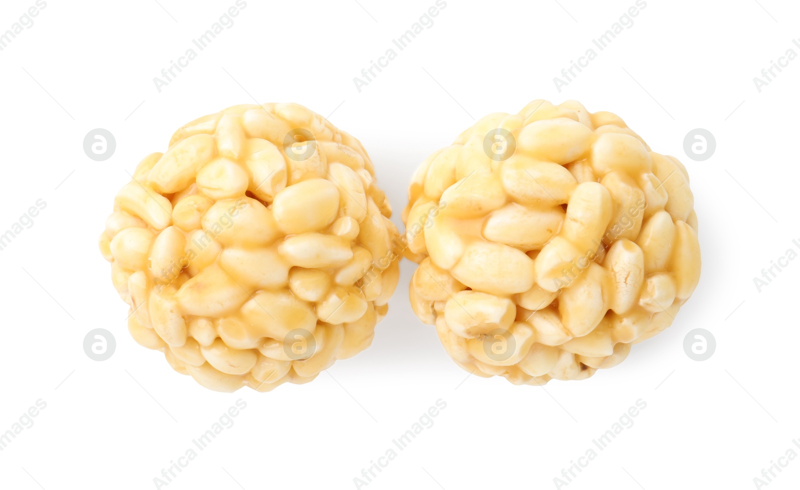 Photo of Delicious puffed rice balls isolated on white, top view