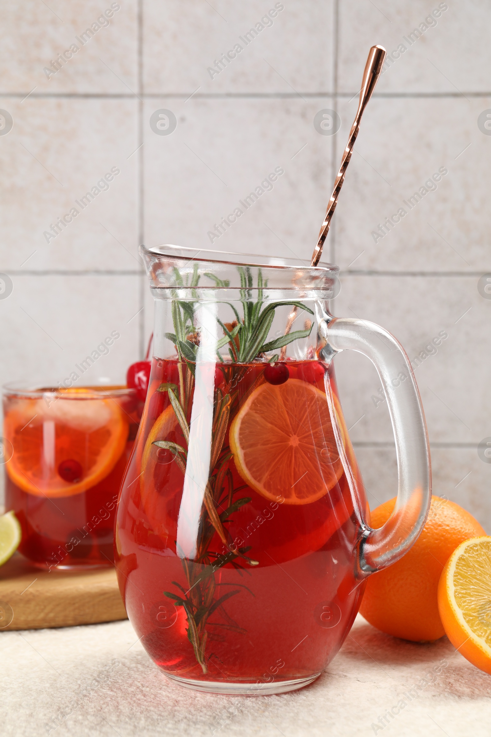 Photo of Delicious punch and ingredients on light table