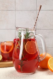 Photo of Delicious punch and ingredients on light table