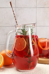 Photo of Delicious punch and ingredients on light table