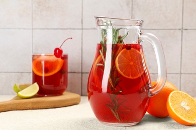 Photo of Delicious punch and ingredients on light table