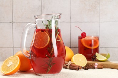 Photo of Delicious punch and ingredients on light table