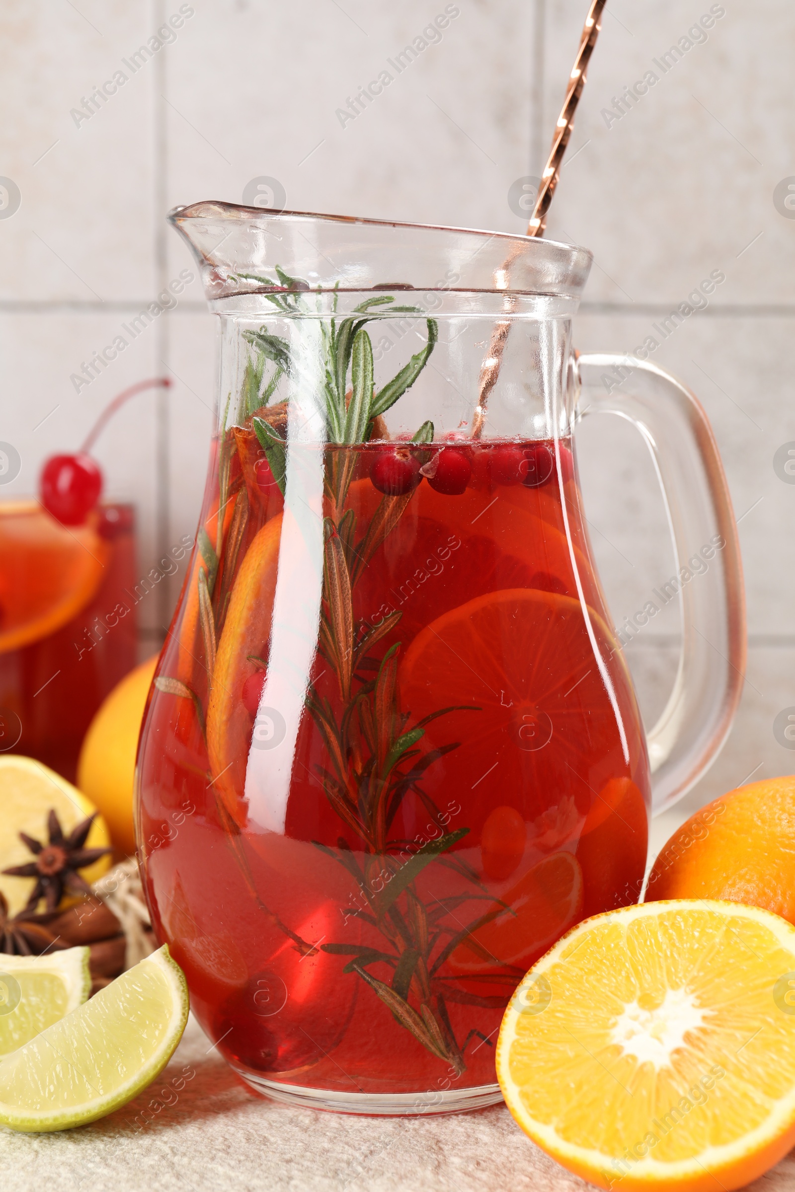 Photo of Delicious punch and ingredients on light table