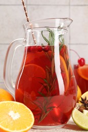 Photo of Delicious punch and ingredients on light table, closeup