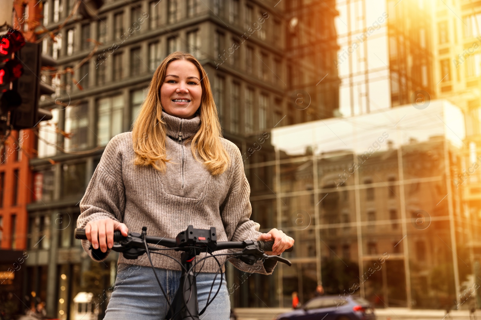 Photo of Woman with bicycle outdoors, low angle view. Space for text