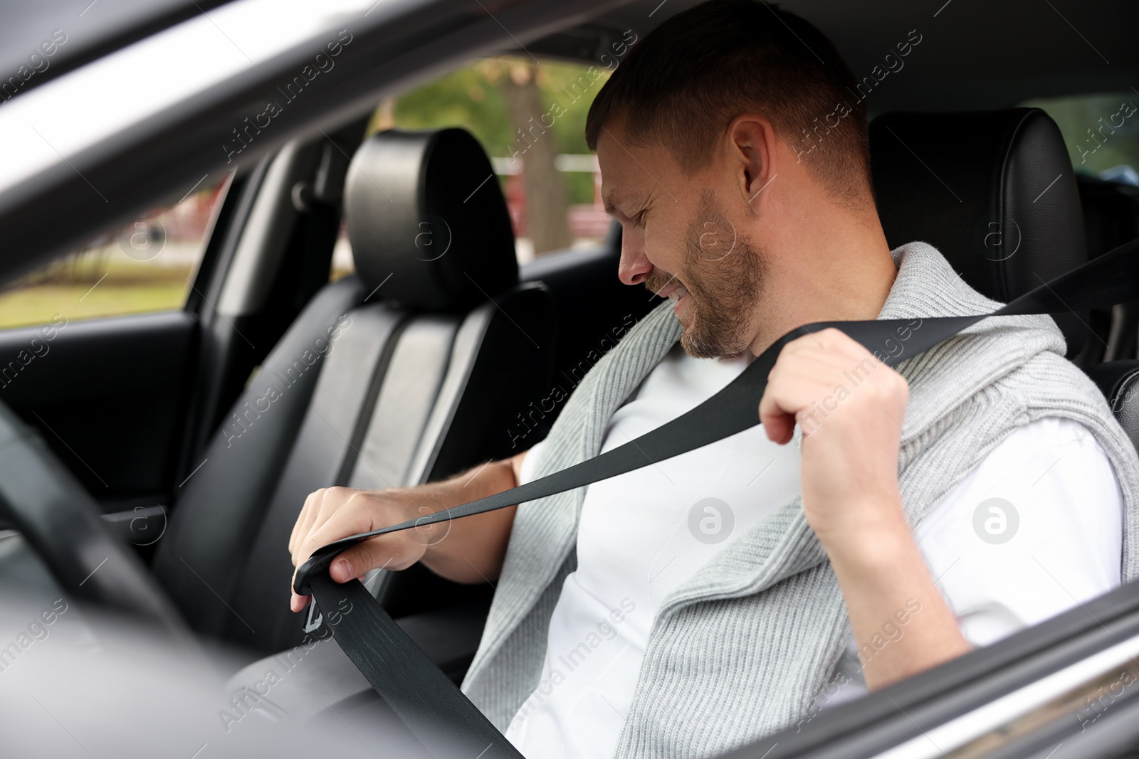 Photo of Man driving modern car, view through window