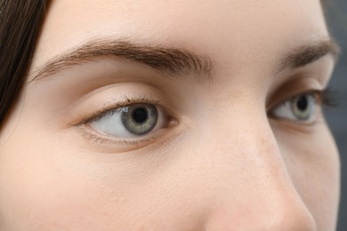 Photo of Closeup view of young woman with beautiful blue eyes