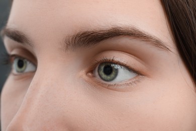 Photo of Closeup view of young woman with beautiful blue eyes