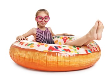 Photo of Happy girl in beachwear with inflatable ring on white background