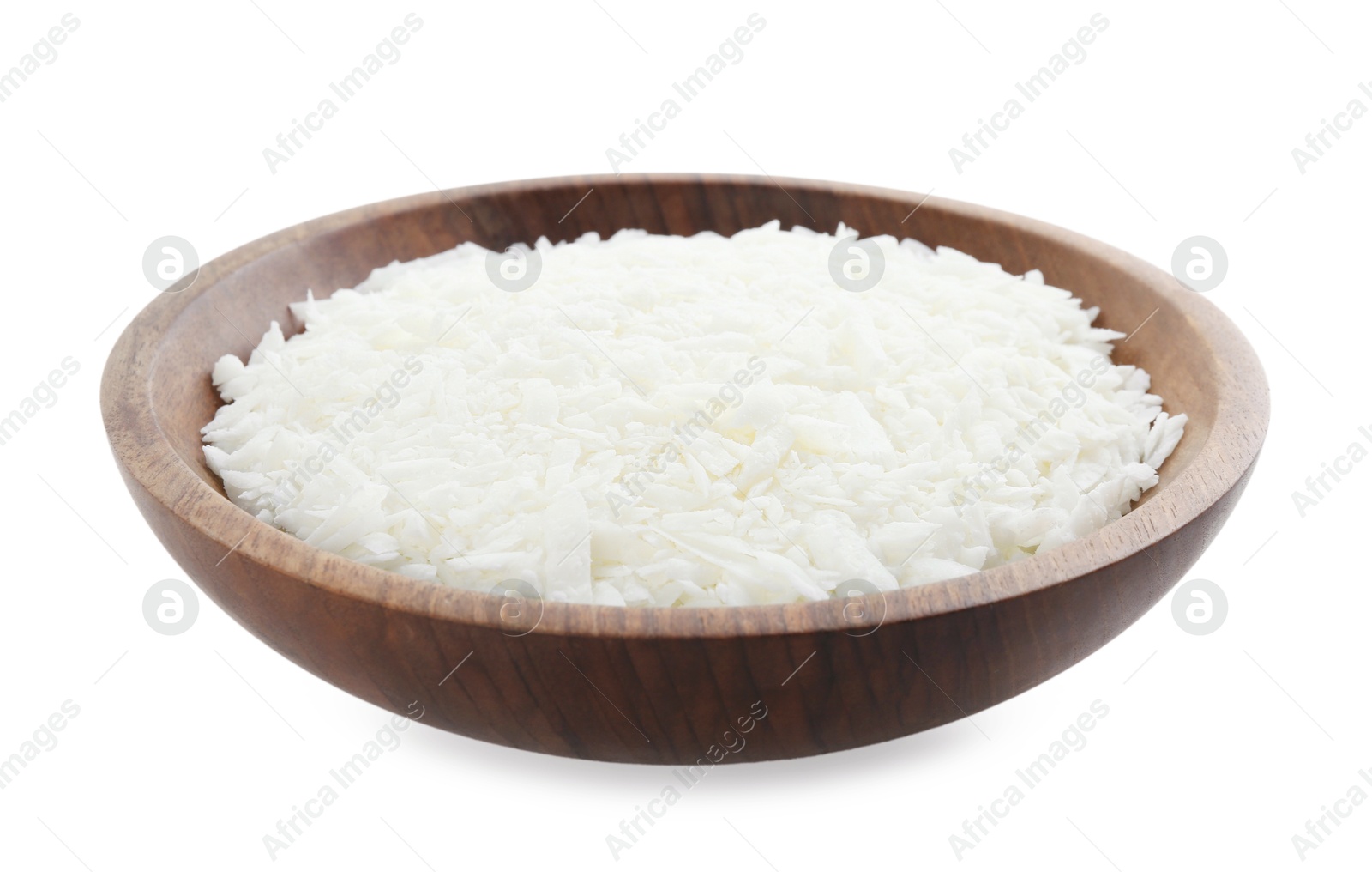 Photo of Soy wax in wooden bowl isolated on white