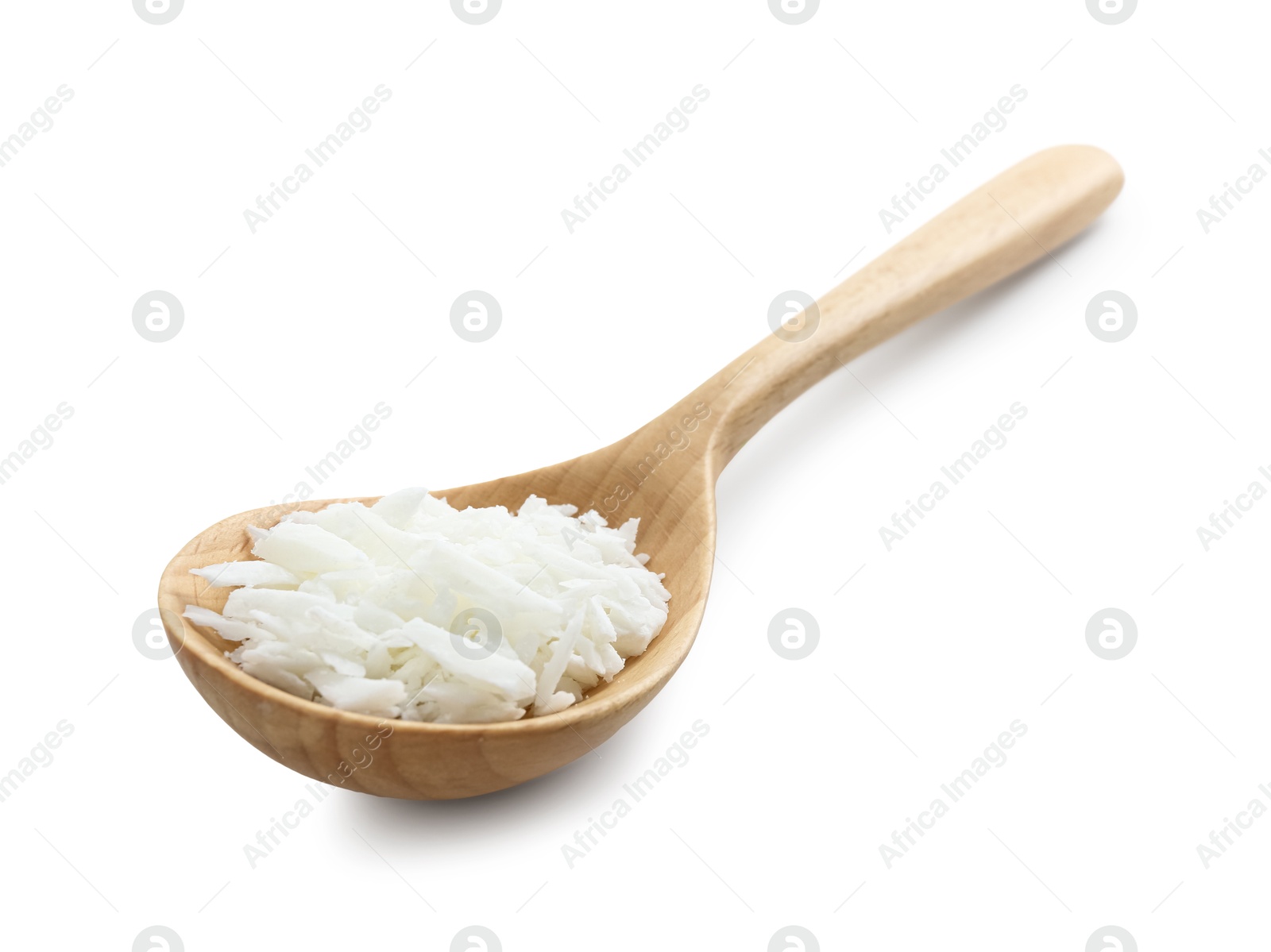 Photo of Soy wax in wooden spoon isolated on white