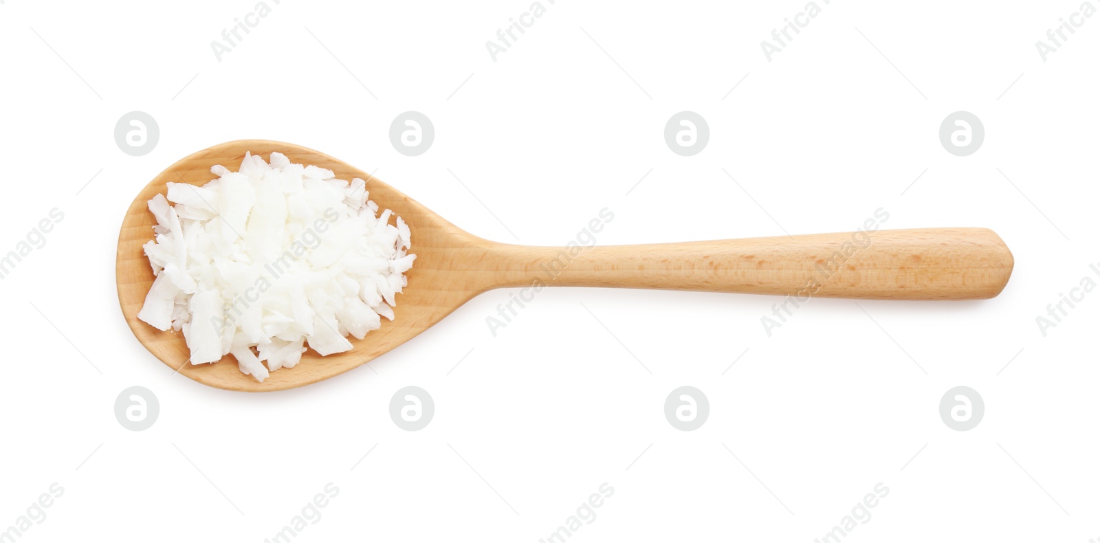 Photo of Soy wax in wooden spoon isolated on white, top view