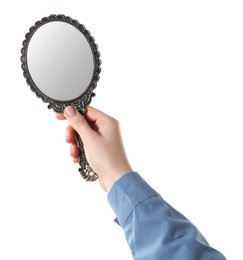 Woman holding vintage mirror on white background, closeup