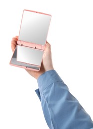 Woman holding pocket mirror on white background, closeup