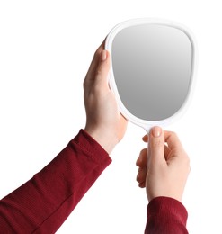 Photo of Woman holding small mirror on white background, closeup