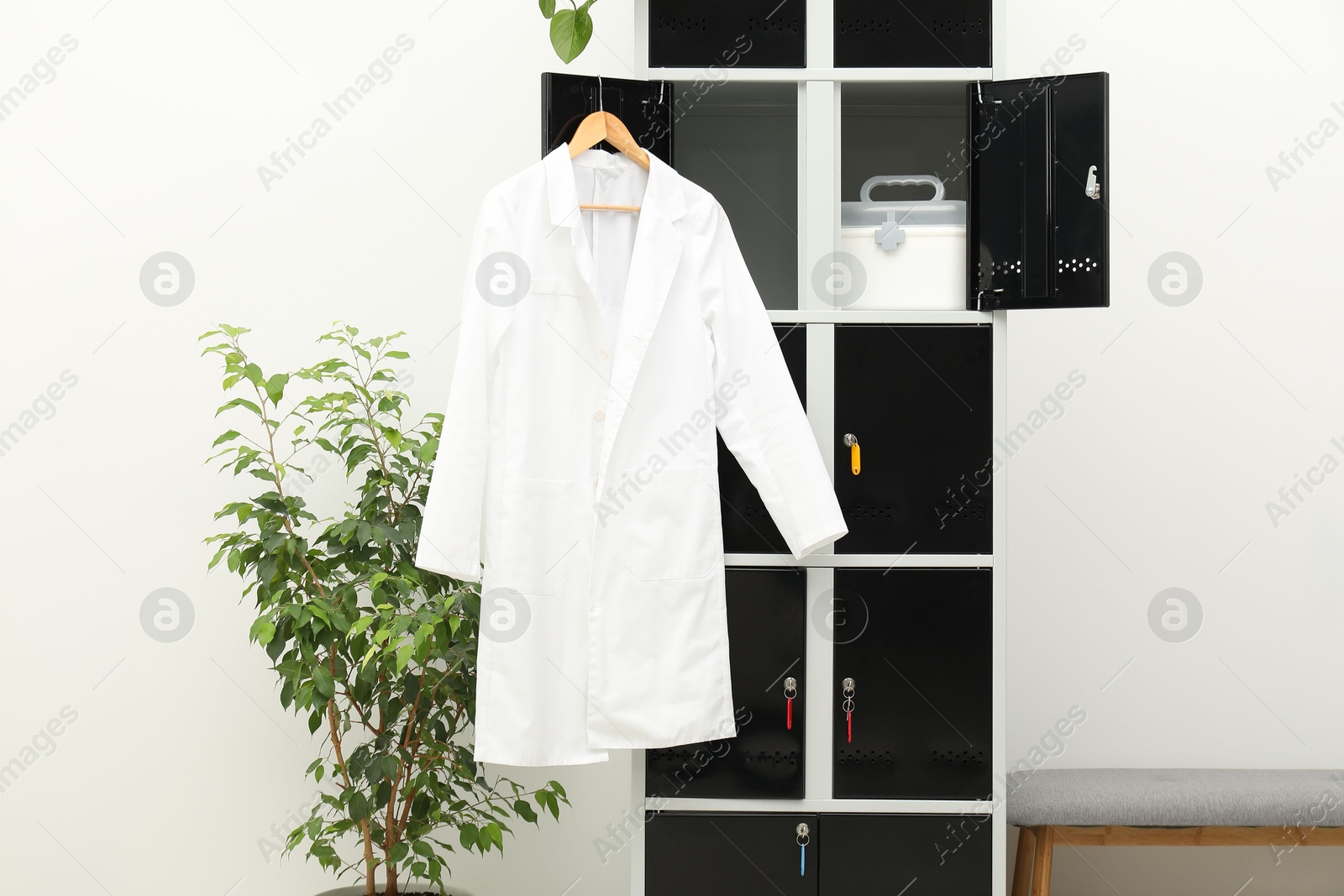 Photo of Medical personnel uniform on locker in changing room