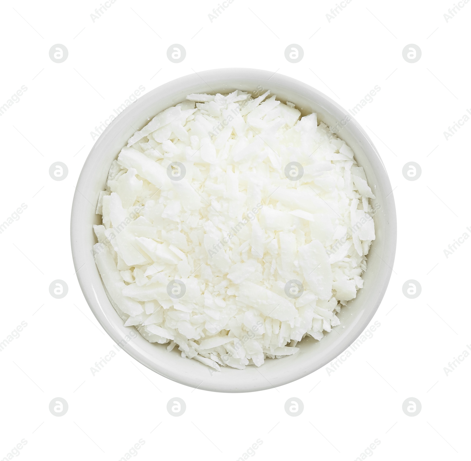 Photo of Soy wax in bowl isolated on white, top view