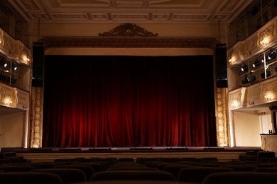 Photo of Theatre interior with stage and rows of comfortable seats