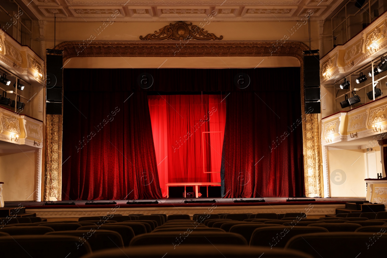 Photo of Theatre interior with stage and rows of comfortable seats